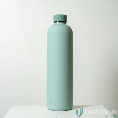 Mint-colored stainless steel Allegra 1L insulated bottle fits in car cup holders with double-wall vacuum