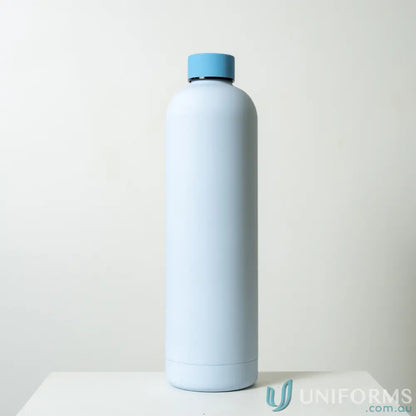 Light blue stainless steel Allegra 1L insulated water bottle with blue cap, fits car cup holders