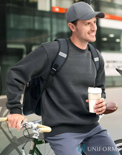 Man with bicycle and backpack wearing American Style Fleece Sweatshirt with crew neck