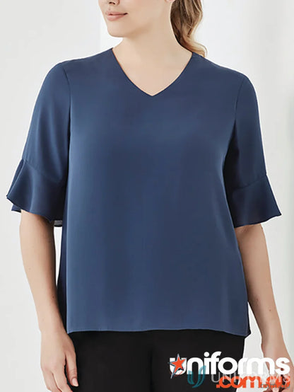 Blue V-neck blouse with flutter sleeves from the Aria Fluted Collection, perfect fluted sleeve blouse for functional workwear options