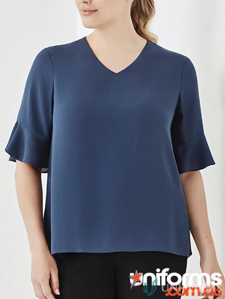 Blue V-neck blouse with flutter sleeves from the Aria Fluted Collection, perfect fluted sleeve blouse for functional workwear options