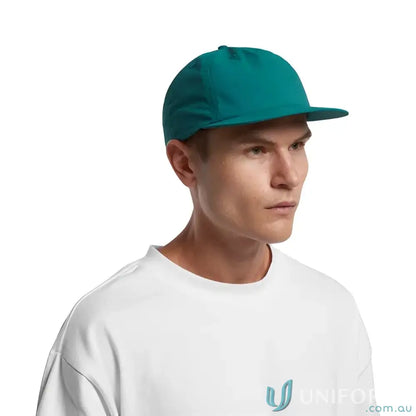 Man wearing teal surf cap made of recycled nylon and plastic snapback style