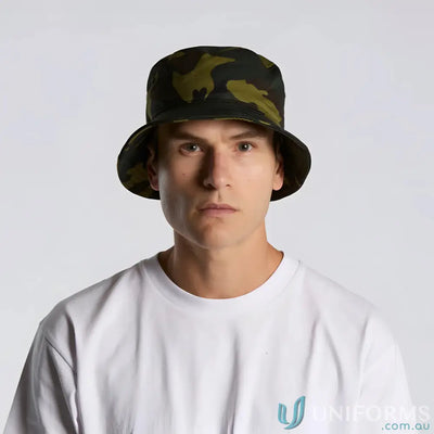 Man wearing a camo bucket hat and white t-shirt, stylish camo bucket headwear