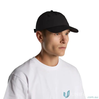 Man wearing black Access Active Cap with curved peak and self-fabric covered velcro