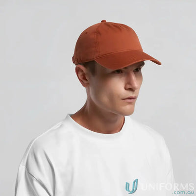 Man wearing AS Colour Access Five Panel Cap with curved peak and adjustable metal clasp