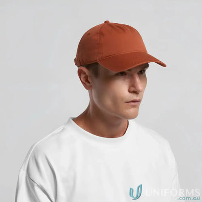 Man wearing AS Colour Access Five Panel Cap with curved peak and adjustable metal clasp