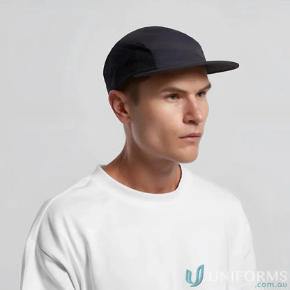 Man wearing a dark blue Recycled Nylon Colour Active Finn Cap and white T-shirt