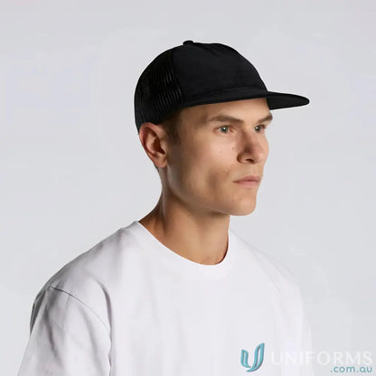 Black cotton 16-wale partridge cord trucker cap with flat peak worn by man in white tee