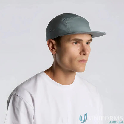 Man wearing slate-blue Finn Five Panel Cap and white tee, stylish five panel cap look