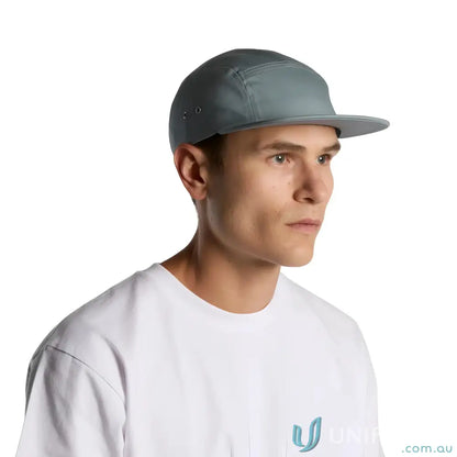 Man wearing light grey Finn Five Panel Cap with flat brim and white t-shirt