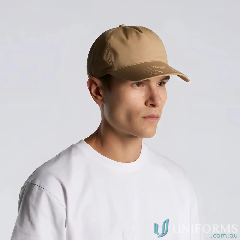 Man in tan baseball cap with curved peak and plastic adjustable snapback