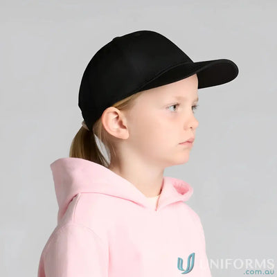 Child wearing black baseball cap and pink hoodie with AS Colour Icon Kids Cap mid profile