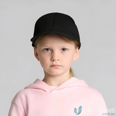 Young girl wearing a black mid profile Icon Kids Cap and pink hoodie