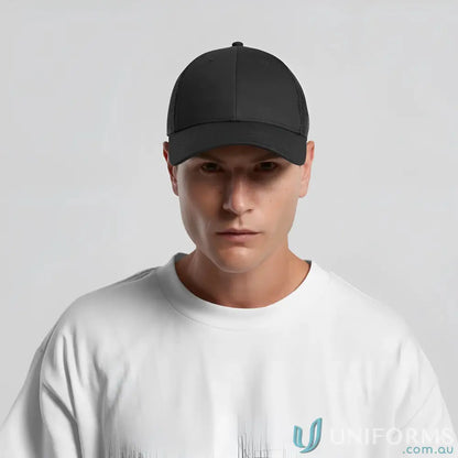 Man in white t-shirt wearing AS Colour Icon Trucker Cap with mid profile and recycled polyester mesh