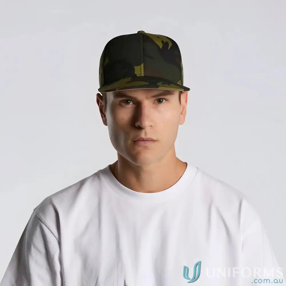 Man wearing AS Colour Stock Camo Cap 1183 with flat peak and white tee