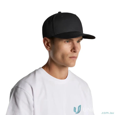 Man wearing black flat peak Colour Stock Flex Cap 1106, high profile five-panel style