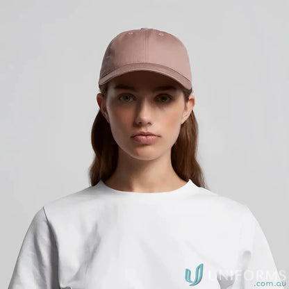 Young woman in white t-shirt and dusty rose access cap with tonal under-peak lining