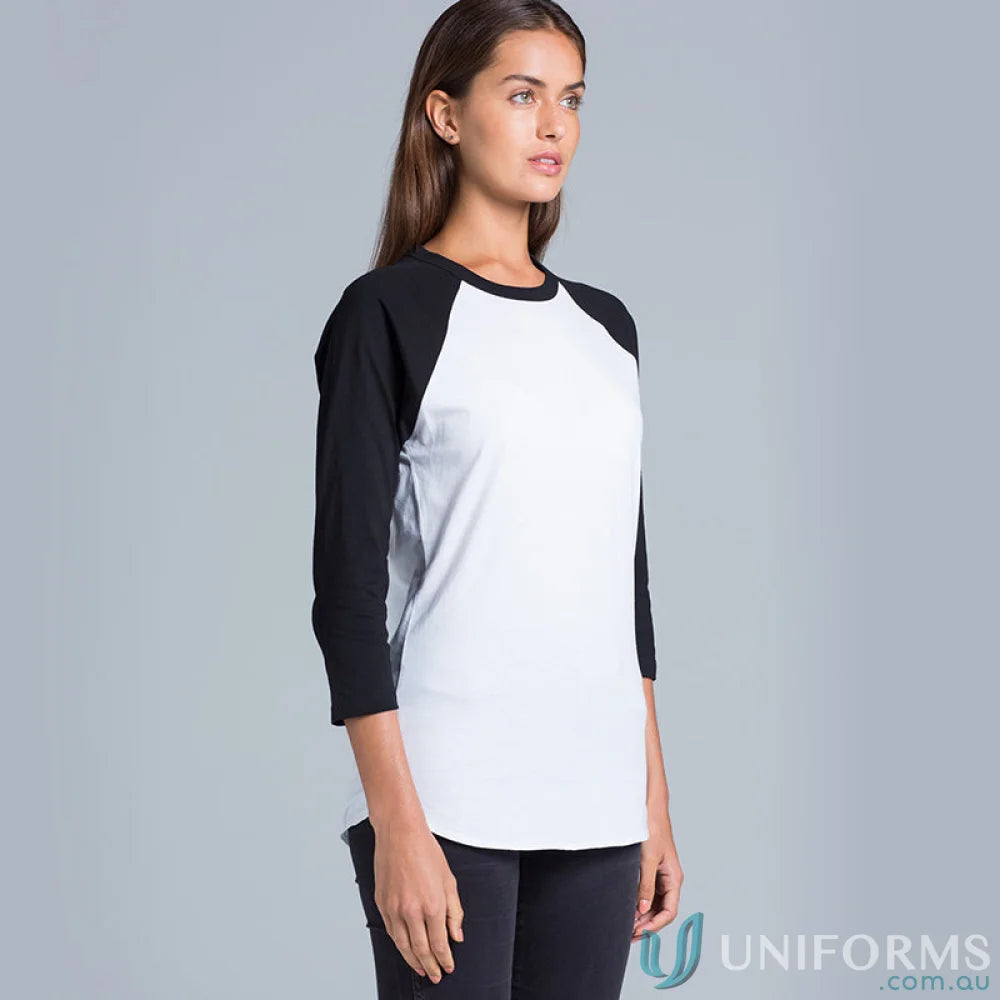 Woman wearing a stylish black and white baseball tee, perfect for workwear or uniforms