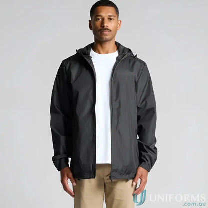 Men’s black section zip jacket with white t-shirt and tan pants for a casual look