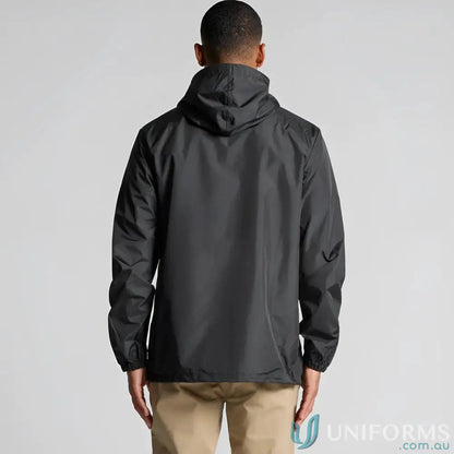 Men’s black section zip jacket with tan pants, perfect for casual style