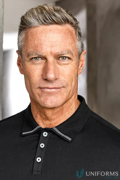Man with gray hair and green eyes in Biz Collection Aston cotton jersey knit polo shirt