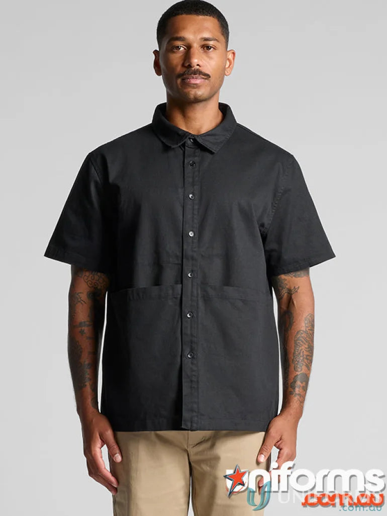 Black short-sleeved barbers shirt for quality workwear by [manufacturer name]