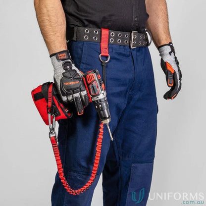 Worker with drill wearing gripps® battery catch holster and reinforced nylon holster