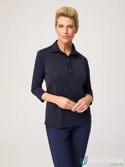 Woman in navy Bella 3q Frill Placket Top with sleeve frill placket and breathable polyester matte