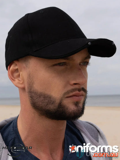 Black baseball cap with LED lights and metal eyelets, perfect for workwear and uniforms