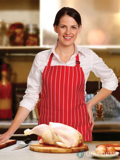 Raw chicken on a cutting board wearing Bib Stripe Apron with adjustable neck strap for cooking