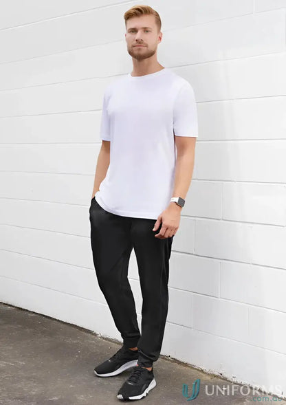 Man in white t-shirt and black Biz Collection Score Pant TP226M for men