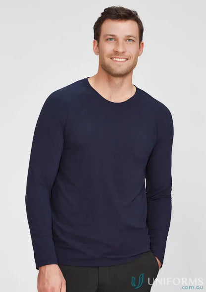 Man in navy Biz Mens Performance LS Tee, the ultimate long sleeve workwear uniform