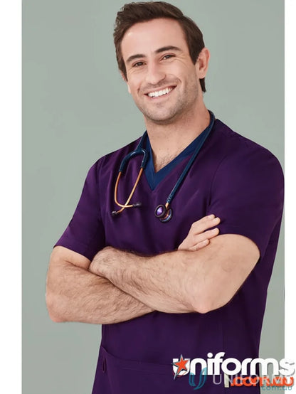 Smiling male nurse in purple Biz Riley V-Neck Scrub Top with stretch panels