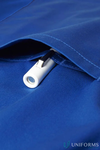 White penlight in blue pocket of Biz Riley V-Neck Scrub Top with stretch panels