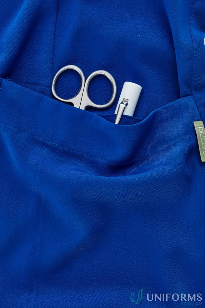 Blue Bizcare Avery Round Neck Scrub Top with pocket contents for women