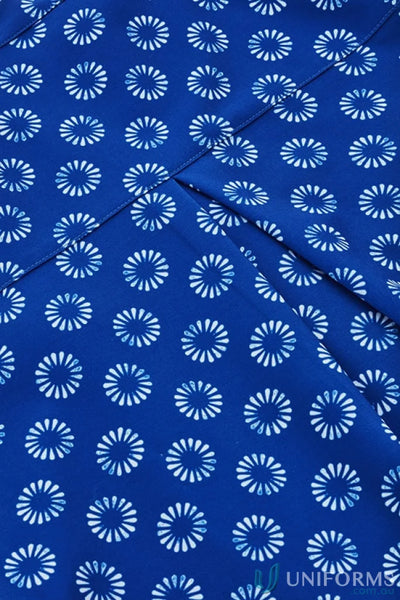 Blue fabric with white floral pattern on Bizcare Women’s Daisy Print Tunic, easy stretch daisy style