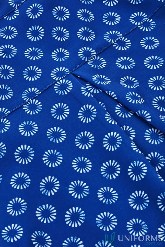 Blue fabric with white floral pattern on Bizcare Women’s Daisy Print Tunic, easy stretch daisy style