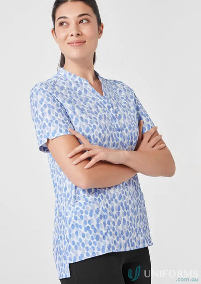 Woman wearing Bizcare Women’s Florence Stardust Print Tunic with blue patterned stardust print