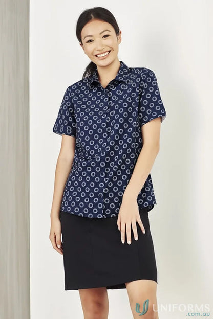 Woman modeling Bizcare Stretch Daisy Print SS Shirt in navy with florence daisy print and effortless style