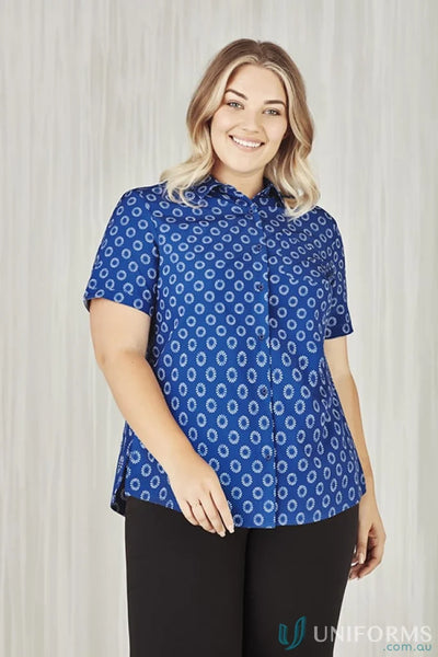 Smiling woman in Bizcare Stretch Daisy Print SS Shirt with florence daisy print and effortless style
