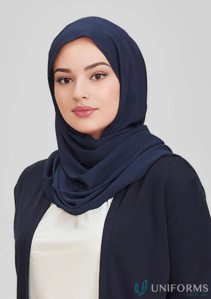 A woman wearing a dark blue hijab and navy cardigan, showcasing Bizcare Womens Hijab
