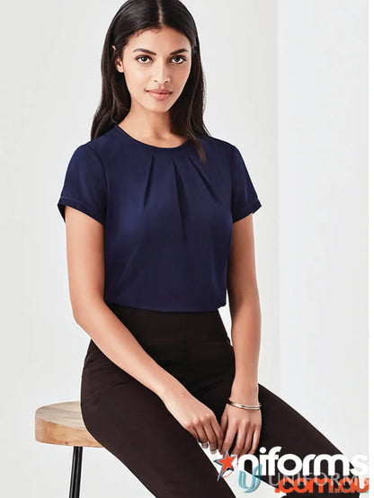 Women’s blaise navy short sleeve blouse in luxe jersey knit with black pants