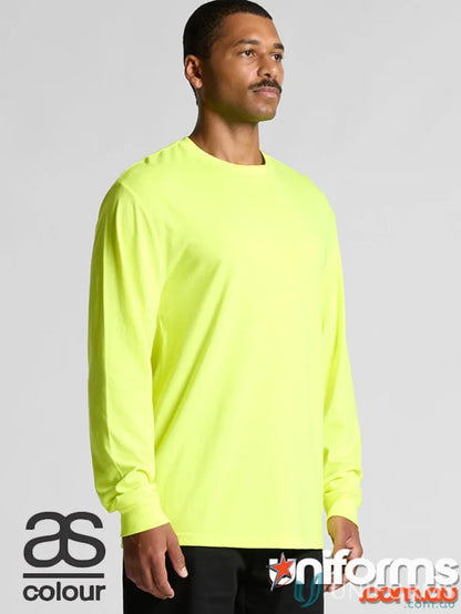 Man wearing neon yellow Block Safety LS Tee, perfect for work uniforms or printing techniques
