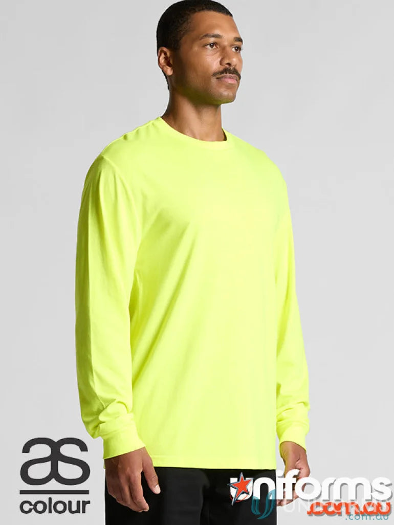 Man wearing neon yellow Block Safety LS Tee, perfect for work uniforms or printing techniques