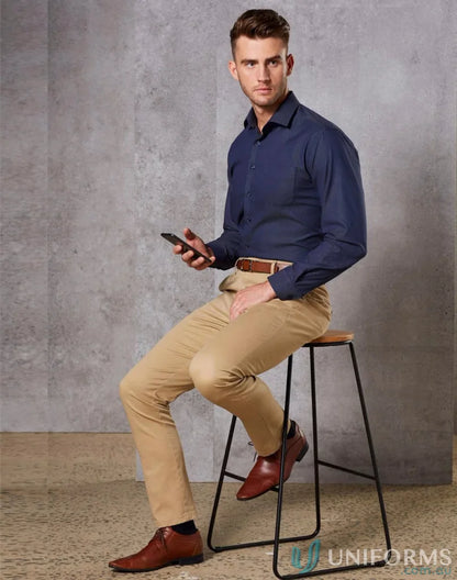 Man in blue shirt and khaki pants wearing Spirit Boston M9380 Men’s Boston Chino Pants