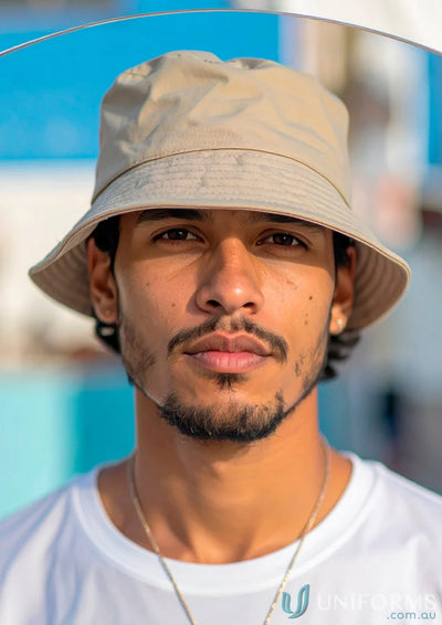 Young man in beige bucket hat wearing workwear breathable poly twill bucket hat