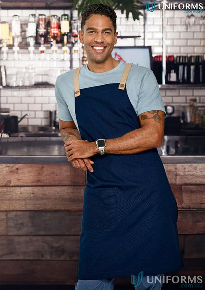 Navy blue Brunswick Bib Apron with tan straps, perfect functional workwear for chefs