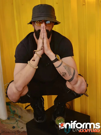 Man in black Winning Spirit Bucket Hat made of heavy brushed cotton and CH29 soft washed style