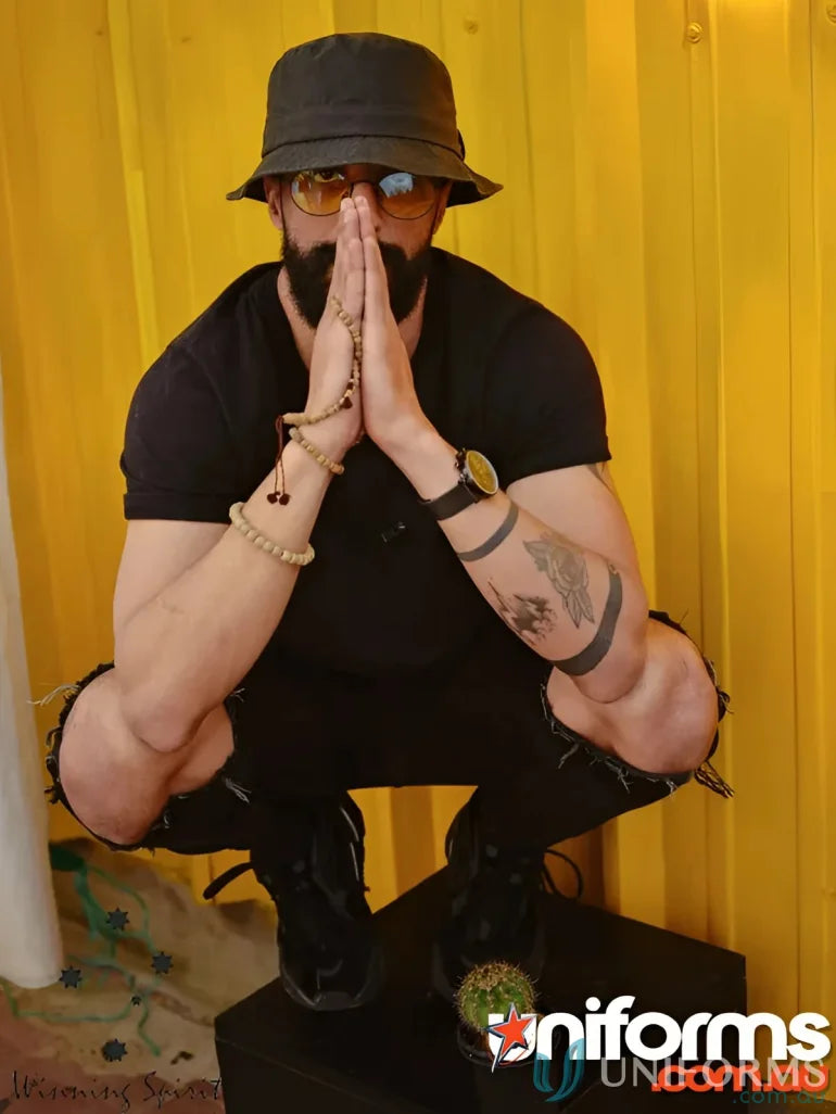 Man in black Winning Spirit Bucket Hat made of heavy brushed cotton and CH29 soft washed style