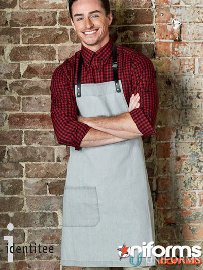 Smiling man in Byron Indigo Apron with red checkered shirt, perfect for uniforms